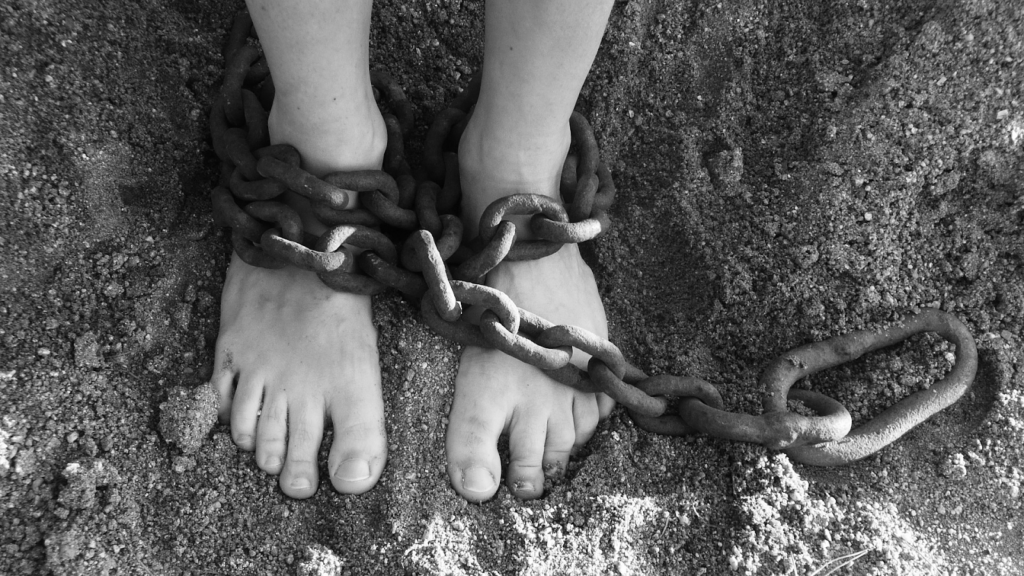 person with shackles on feet