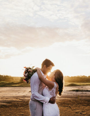 Man and woman kissing in the sunset