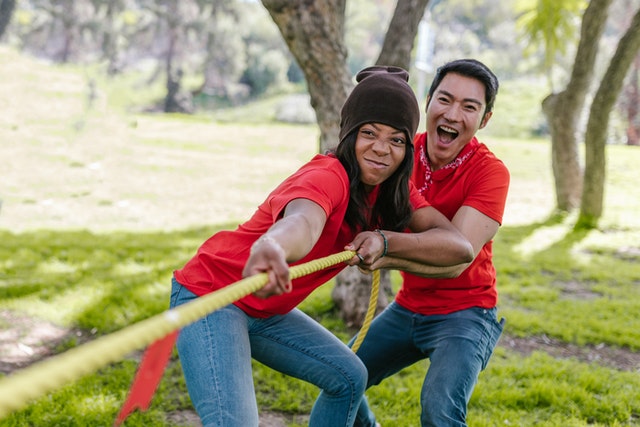 A couple playing tug-of-war