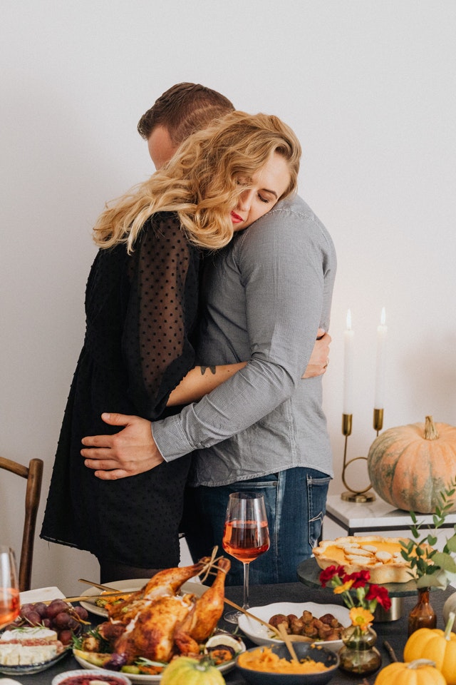 A man and woman hugging peacefully.